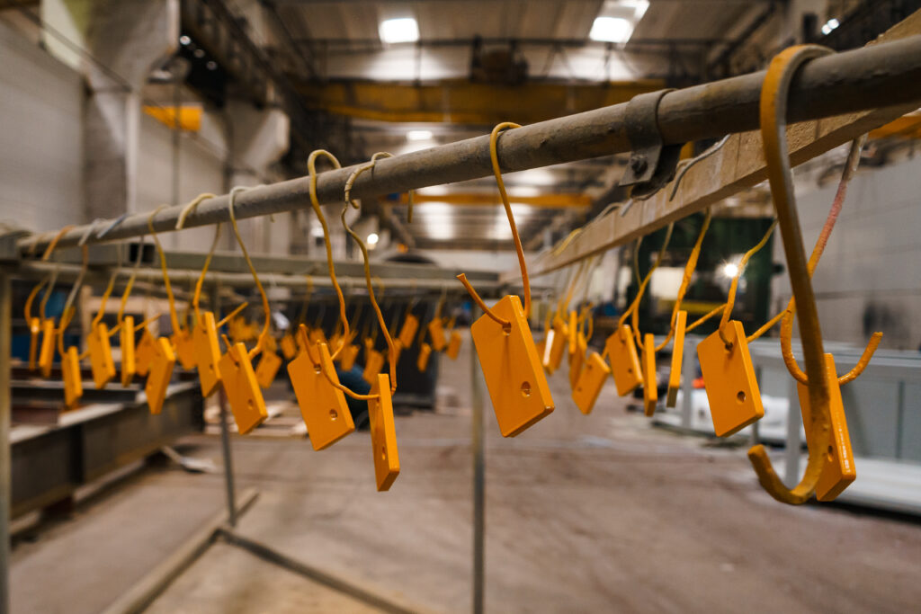 handles hung by wire for painting